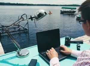 Working on laptop at the lake