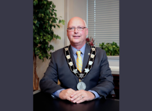 Warden Bresee wearing Chain of Office
